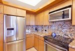 Gold remodel kitchen, stainless appliances and granite counter tops